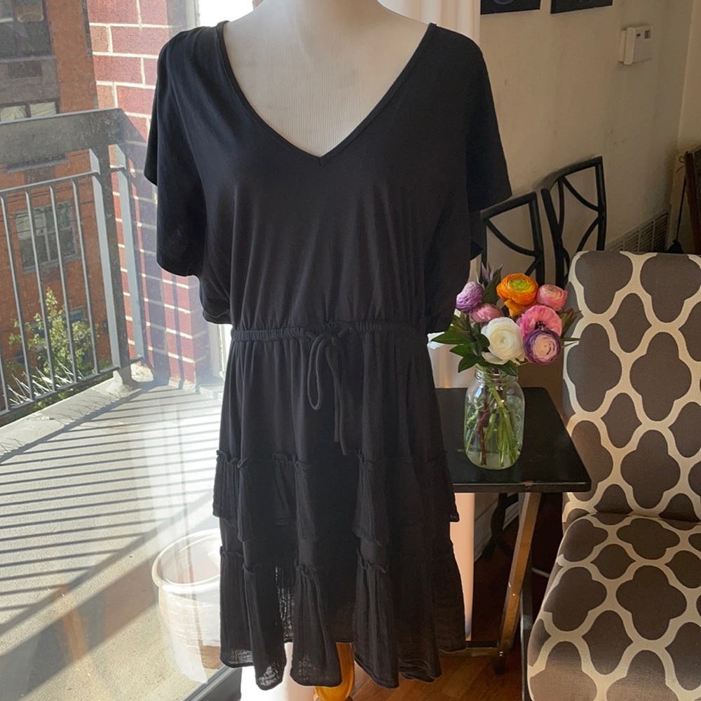 Tiered ruffle mini dress with open back.